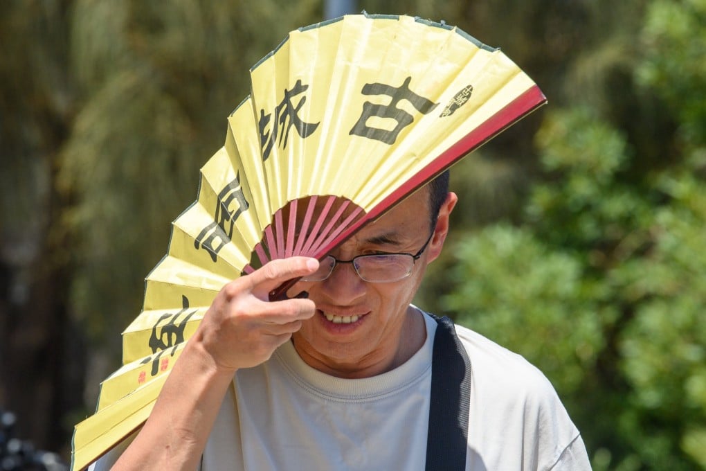 A man shades himself from the searing sun in Melbourne, Australia in January. Photo: EPA