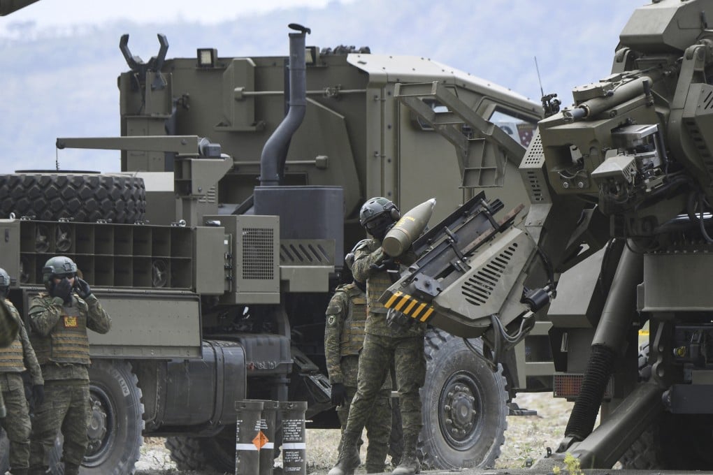 Philippine soldiers load ammunition into an Autonomous Truck Mounted Howitzer System (Armos) during a live-fire exercise in 2024. Photo: AFP