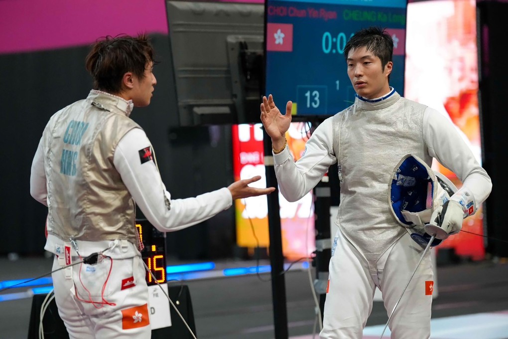 Cheung Ka-long (right) commiserates with Ryan Choi after narrowly beating his fellow Hongkonger in Peru. Photo: Handout