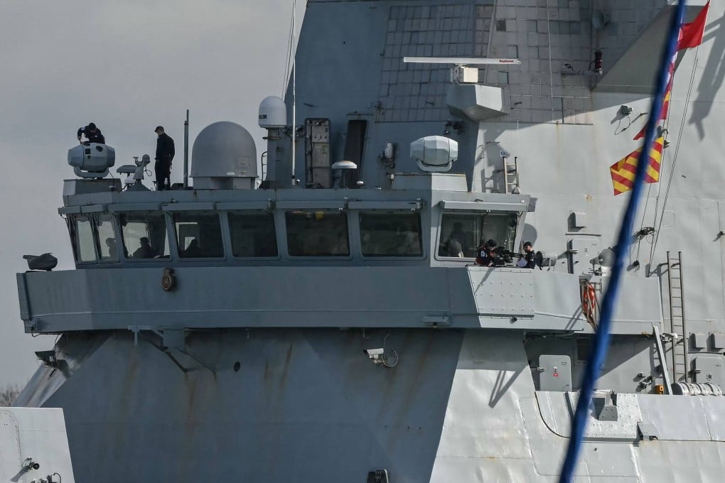 Crew members check equipment on the bridge of the British warship, HMS Dragon. Photo: AFP