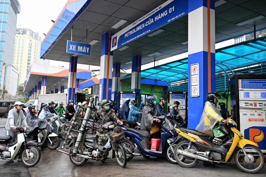 Drivers wait to pump petrol into their vehicles in Hanoi on March 9. The cost of fuel in Vietnam has soared since the Iran war broke out late last month. Photo: AFP