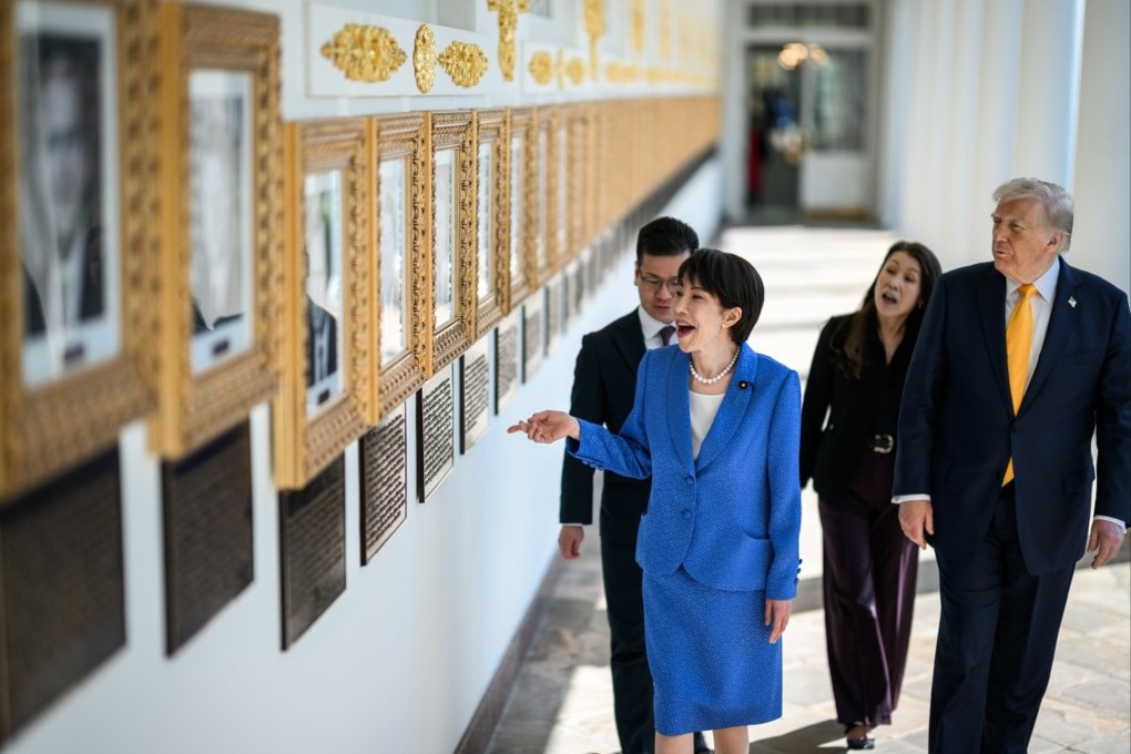 Japanese Prime Minister Sanae Takaichi points and laughs at a portrait in US President Donald Trump’s Presidential Walk of Fame at the White House on March 19. Photo: White House