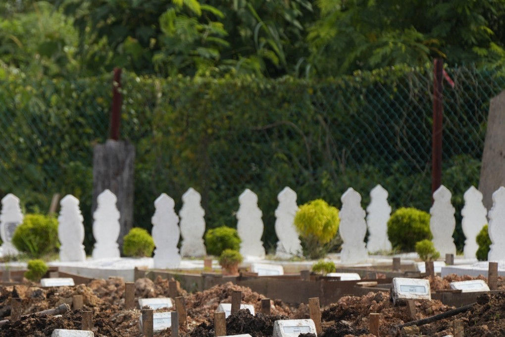 A couple’s intimate moment at a Malaysian cemetery was caught on camera, sparking outrage. Photo: AP