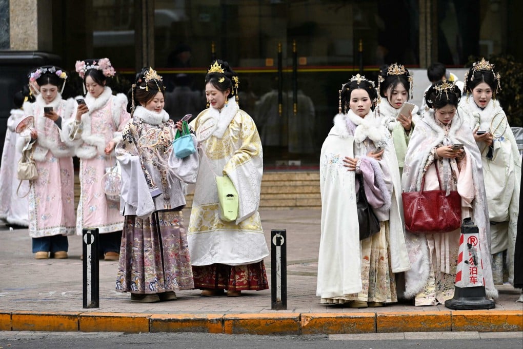 Women, dressed in traditional Chinese outfits, seen in Beijing on January 14, 2026. Photo: AFP