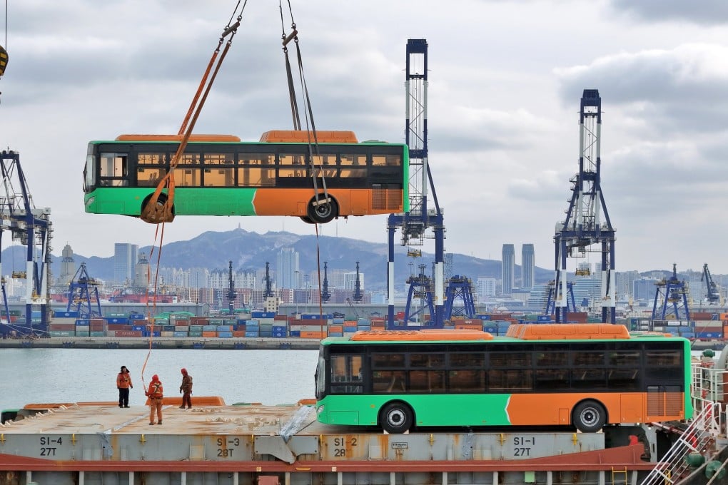 Natural gas-powered buses bound for Mexico are loaded onto a ship at Yantai Port in east China’s Shandong province. Photo: Xinhua