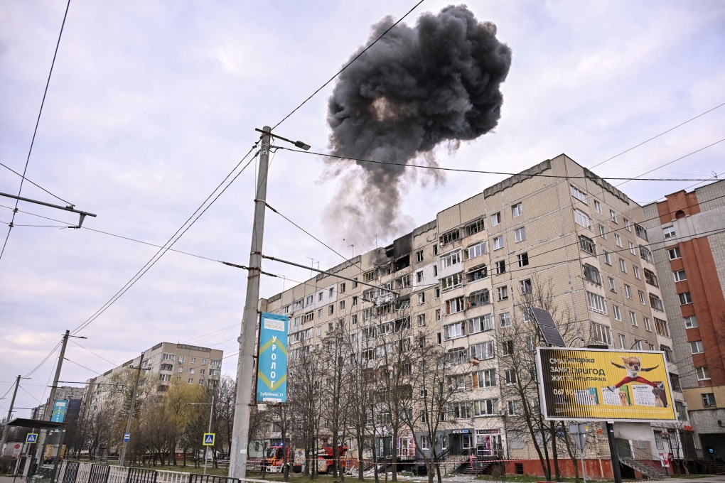 Smoke rises from a residential building in Lviv after a drone strike. Photo: Reuters