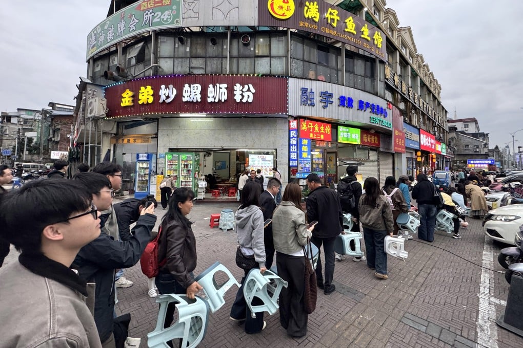 People queue to enter a shop in Liuzhou city, Guangxi Zhuang Autonomous Region, on March 10. Photo: Xinhua