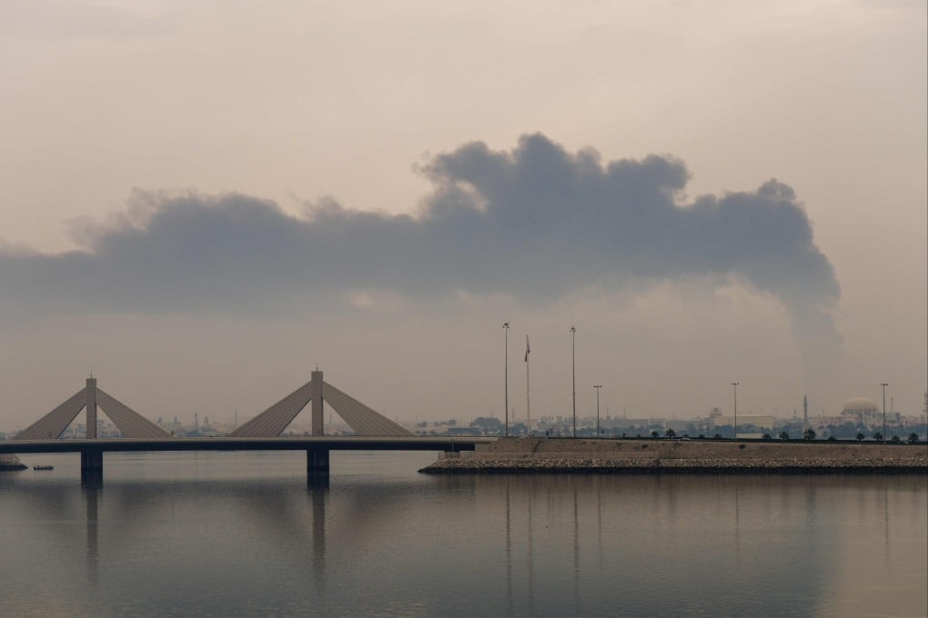 A plume of smoke rises after a reported Iranian strike on fuel tanks in Muharraq, Bahrain, on March 12. Photo: AFP