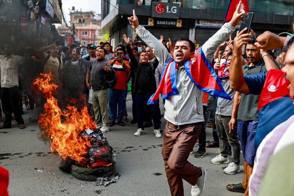 People burn tyres during a demonstration in Kathmandu on September 9 to condemn the Nepali police’s deadly crackdown on protesters. Photo: AFP