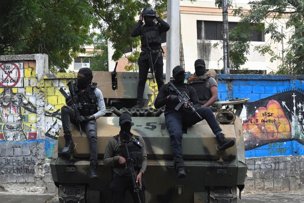 Haitian security forces on an armoured vehicle guard the area near the National Palace in Port‑au‑Prince. Photo: Reuters