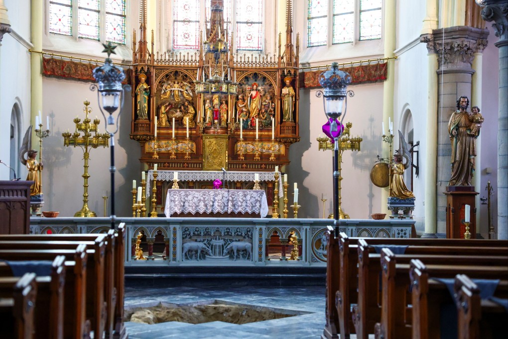 An excavation pit opened in the floor at the Peter and Paul Church in Maastricht, Netherlands, where archaeologists believe they may have uncovered the skeletal remains of musketeer d’Artagnan. Photo: Reuters