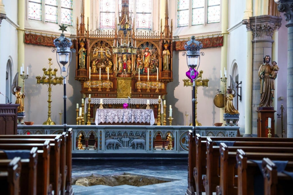An excavation pit opened in the floor at the Peter and Paul Church in Maastricht, Netherlands, where archaeologists believe they may have uncovered the skeletal remains of musketeer d’Artagnan. Photo: Reuters