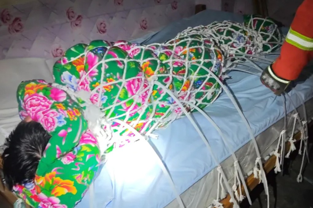 A Chinese man attempting an online zip tie escape challenge at home had to be rescued by firefighters after he became trapped in a precarious situation. Photo: QQ.com