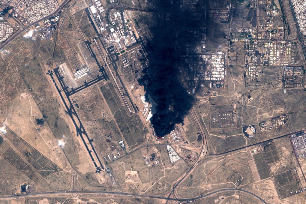Smoke plumes billowing in the vicinity of Kuwait International Airport on Wednesday after drones hit a fuel tank and sparked a fire. Photo: European Space Agency via AFP