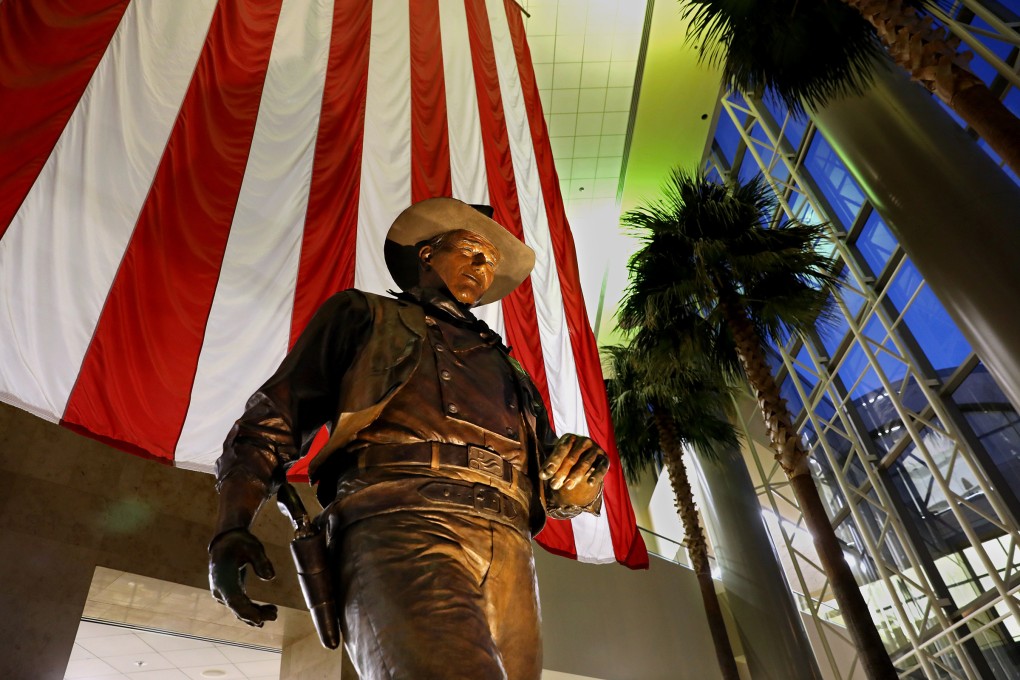 A John Wayne memorial statue is seen in the Thomas F. Riley Terminal at John Wayne Airport in California in July 2020. Photo: TNS