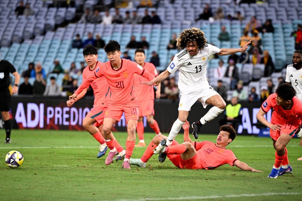 Curacao’s Tahiti Chong (centre) is tackled by Wang Yudong of China in their Fifa Series match at Accor Stadium in Sydney, Australia, on Friday. Photo: EPA