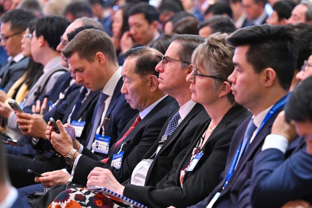 Guests attend the China Development Forum in Beijing on March 22. Photo: Xinhua