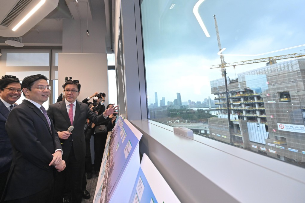 Prime Minister Lawrence Wong (second left) is briefed by Secretary for Innovation, Technology and Industry Sun Dong (third left) during his visit to the Hong Kong park in the Hetao cooperation zone. Photo: Handout
