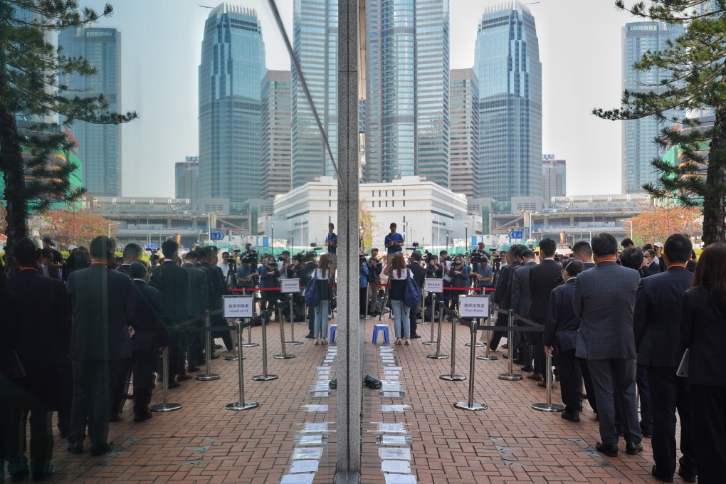 Legal representatives queue up to enter City Gallery for the afternoon session of the first day of the public inquiry hearing of the deadly fire of Wang Fuk Court in Tai Po, Hong Kong, on March 19. Photo: Elson Li