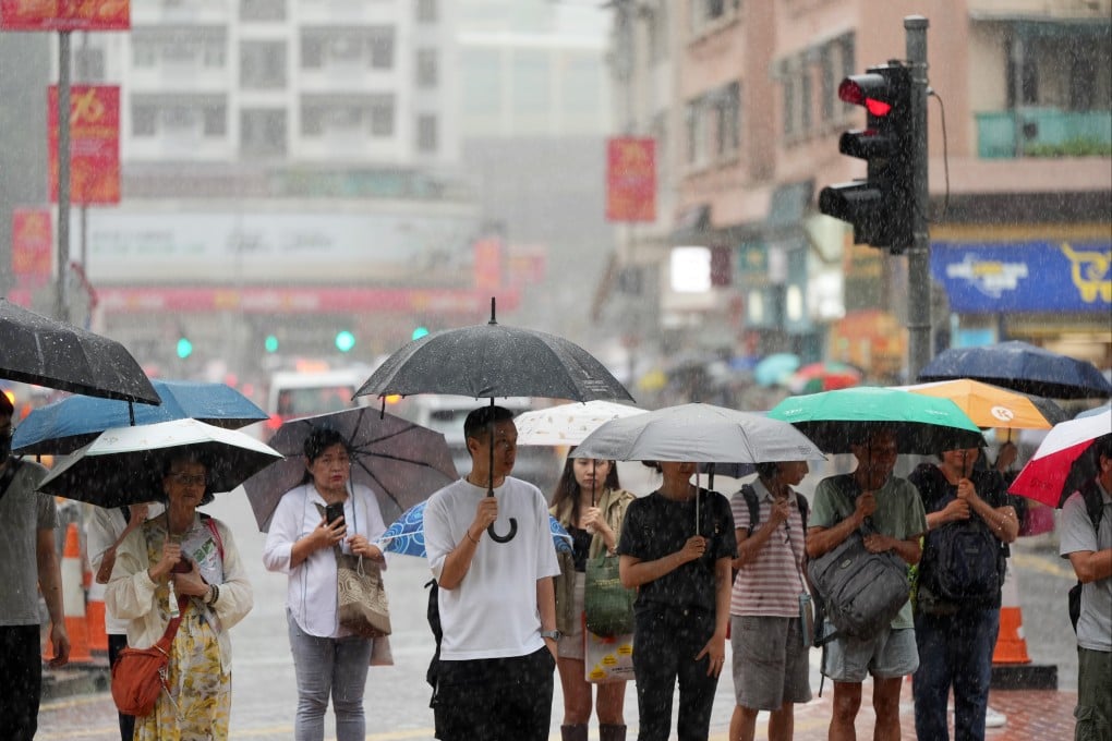 Residents brave the heavy rain last September. Photo: Sam Tsang