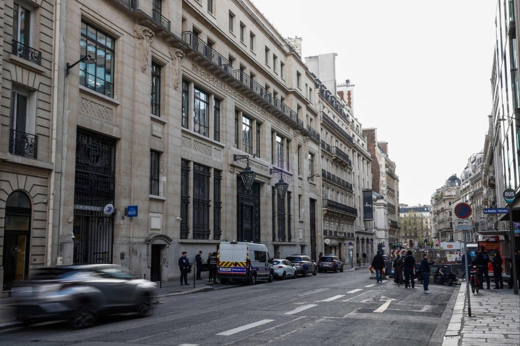 The Bank of America building with police and private security vehicles in the 8th arrondissement of Paris on Saturday, following an apparent bomb attack attempt. Photo: AFP