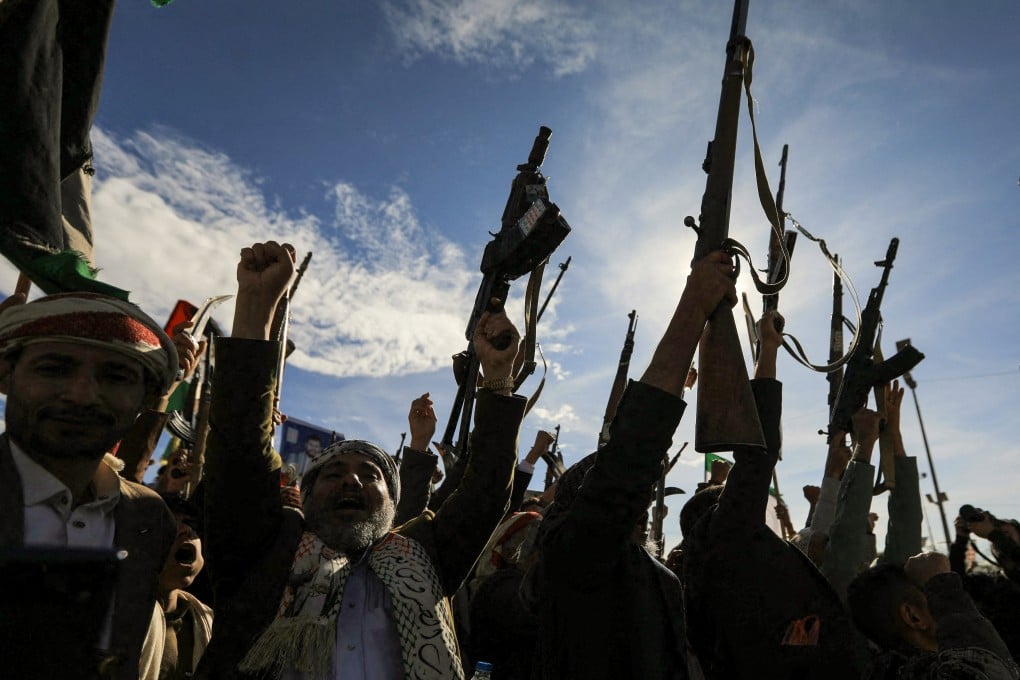 Houthis brandish their weapons as they rally in solidarity with Iran and Lebanon, amid the US-Israeli war with Iran, in the Yemeni capital Sanaa on Friday. Photo: AFP