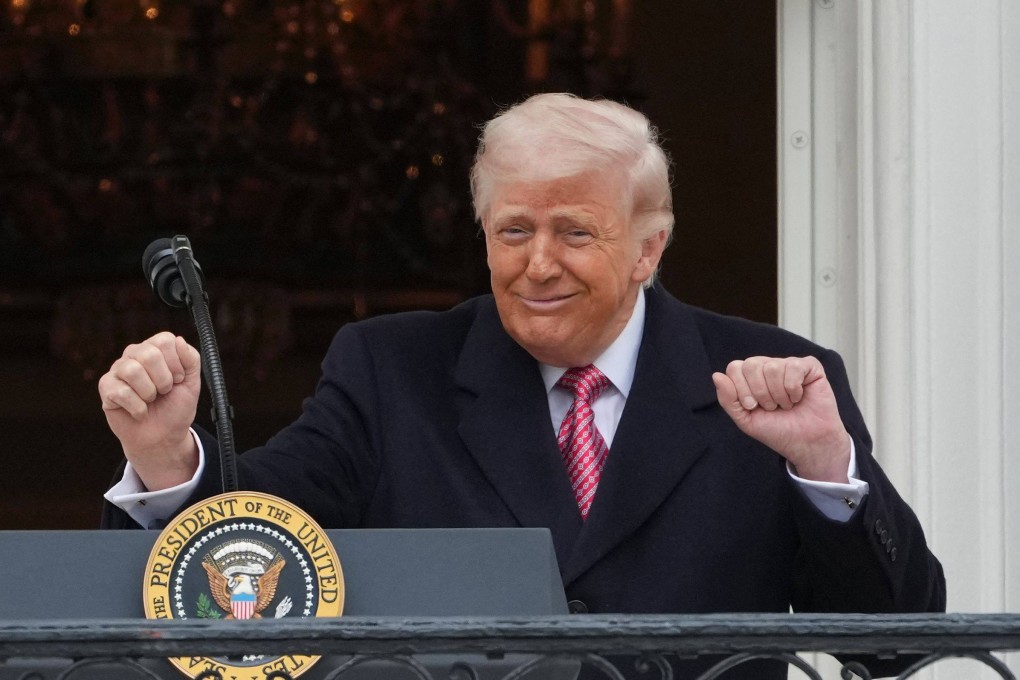 US President Donald Trump gestures to farmers from the Truman balcony of the White House in Washington on Friday. Photo: AFP
