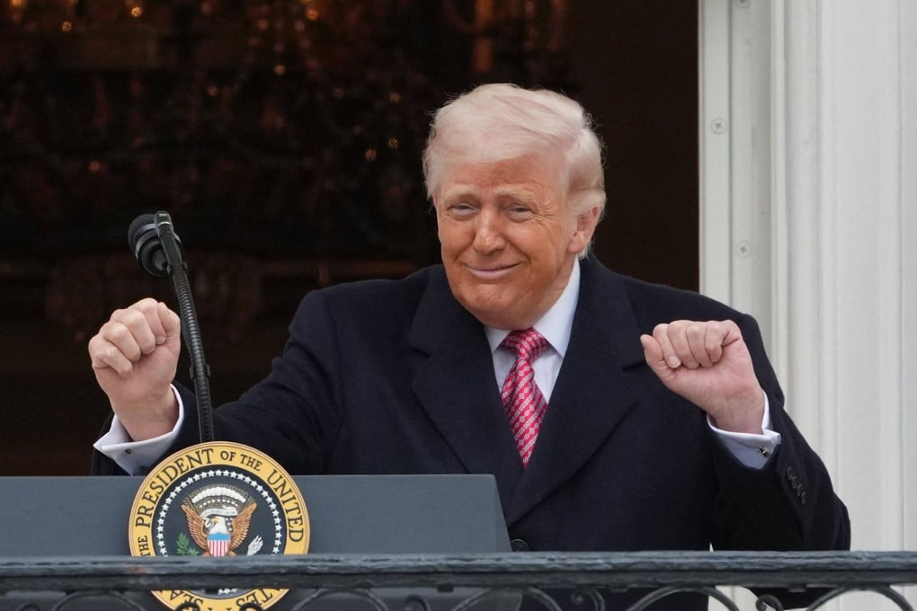 US President Donald Trump gestures to farmers from the Truman balcony of the White House in Washington on Friday. Photo: AFP