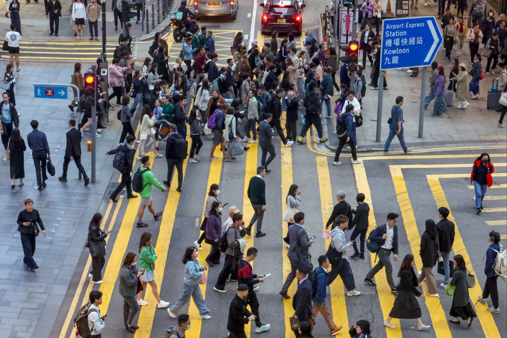 People cross the street at Central, Hong Kong’s premier business district.
Photo: Dickson Lee