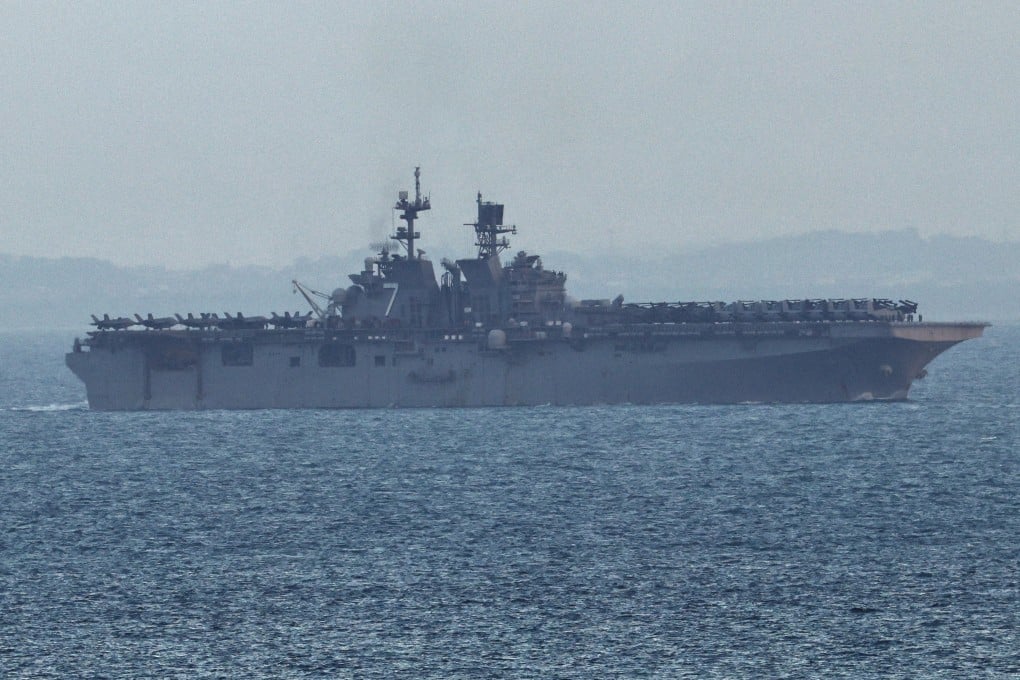 The USS Tripoli enters the Singapore Strait on March 17. Photo: Reuters