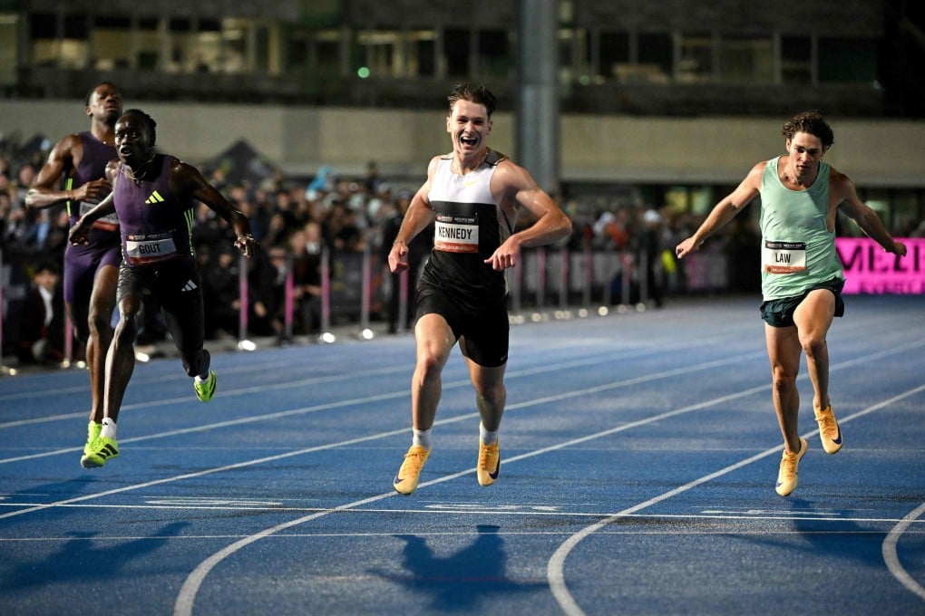 Lachlan Kennedy (centre) crosses the finish line to win the men’s 200m event just ahead of rival Gout Gout (left) at the Maurie Plant Athletics Meet in Melbourne on Saturday. Photo: AFP
