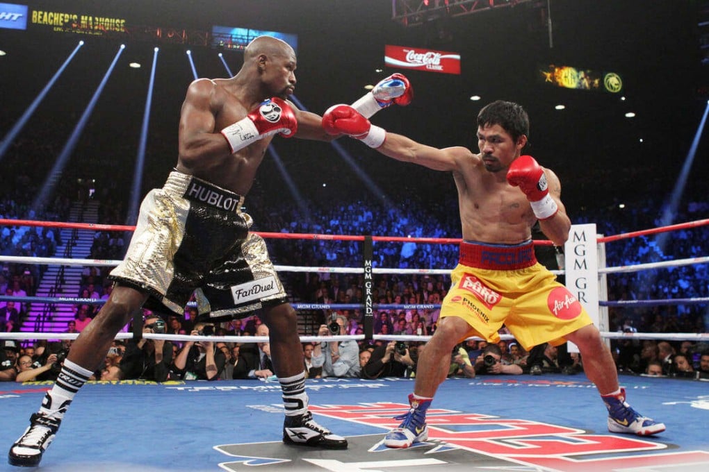 Floyd Mayweather Jnr (left) beat Manny Pacquiao in their welterweight boxing match at the MGM Grand Garden Arena in Las Vegas in 2015 that promoters said was the most profitable fight in history, setting pay-per-view records. Photo: TNS