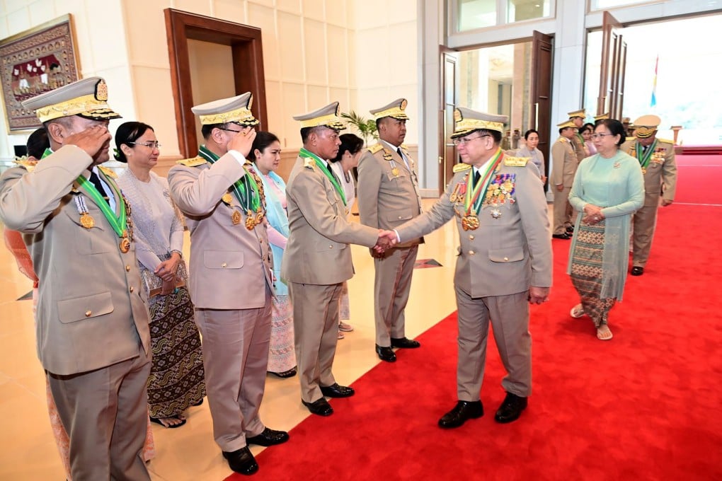 Outgoing Myanmar military Commander-in-Chief Senior General Min Aung Hlaing (right) greets leaders as he leaves after a ceremony to transfer the duties of the Myanmar military commander-in-Chief in Myanmar on Monday. Photo: EPA