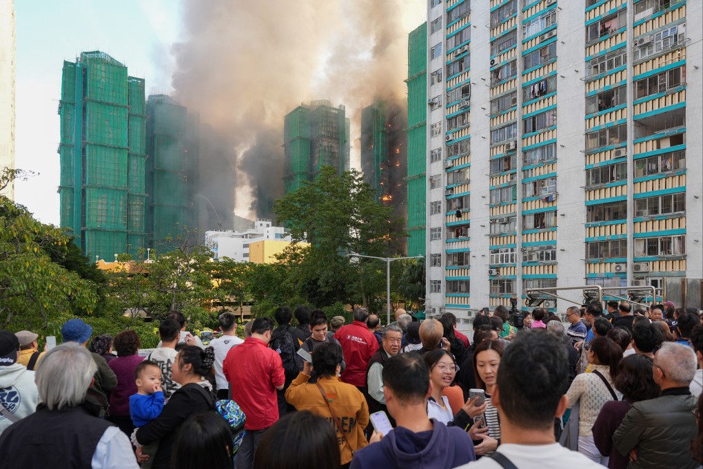 Residents evacuate Wang Fuk Court on November 26. Photo: Eugene Lee