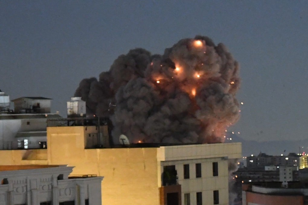 Smoke rises from buildings following air strikes in Iran’s capital, Tehran, on Sunday night. Photo: Xinhua