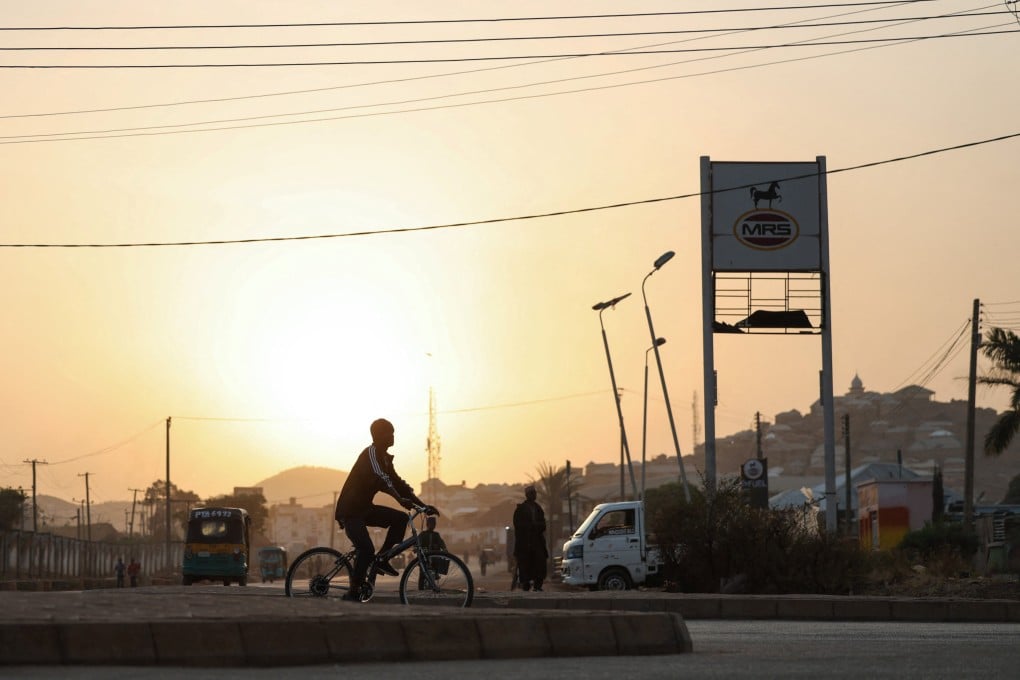 A person rides a bicycle in Jos, Plateau State in Nigeria. Jos has seen bouts of sectarian violence in the past, but deadly, mass casualty attacks in the crowded city have been rare in recent years. Photo: Reuters