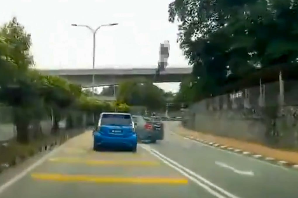 A screengrab of footage of the crash in Klang, Malaysia, shows an allegedly speeding Honda City entering the opposite lane, and crashing into a motorcycle coming from the other direction. Photo: Handout
