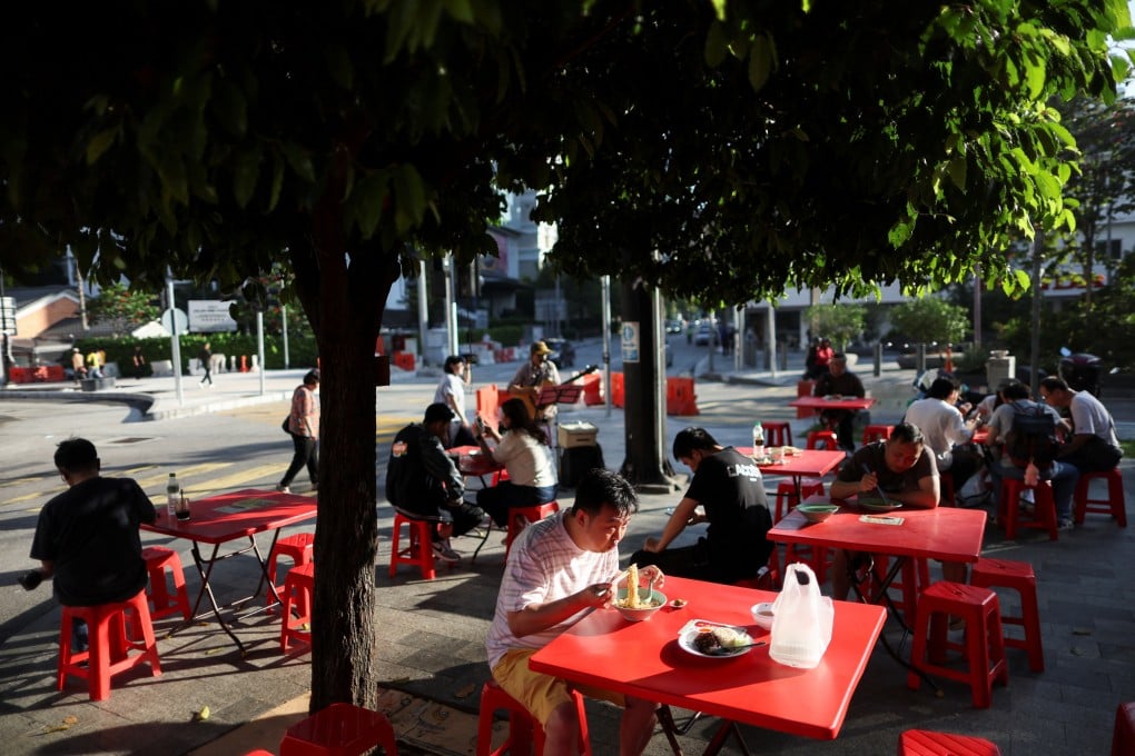 People have their breakfast at a kopitiam in Kuala Lumpur, Malaysia, on March 17. Photo: Reuters
