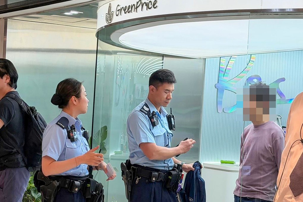 Hong Kong police question the man at New Town Plaza in Sha Tin. Photo: Threads / hazelwong
