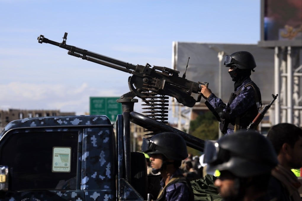A Houthi soldier mans a machine gun on a pickup truck while on patrol during a rally in solidarity with Iran in Sanaa, Yemen, on Friday. Photo: EPA