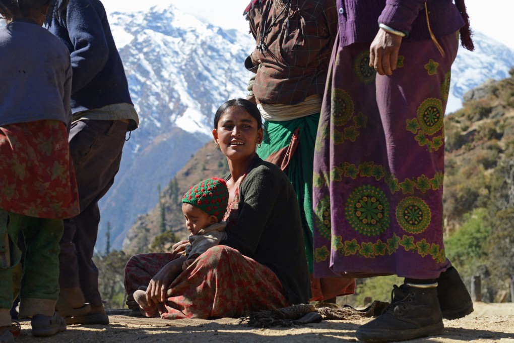 A Dalit woman sits with a child in Humla district, in Nepal’s remote northwest. Photo: AFP