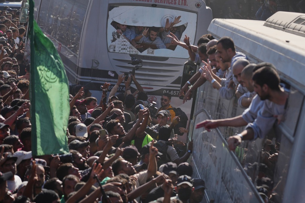 People gather to greet freed Palestinian prisoners arriving on buses after their release from Israeli jails. On Monday, Israel approved the death penalty for Palestinians convicted of murdering Israelis. Photo: AP