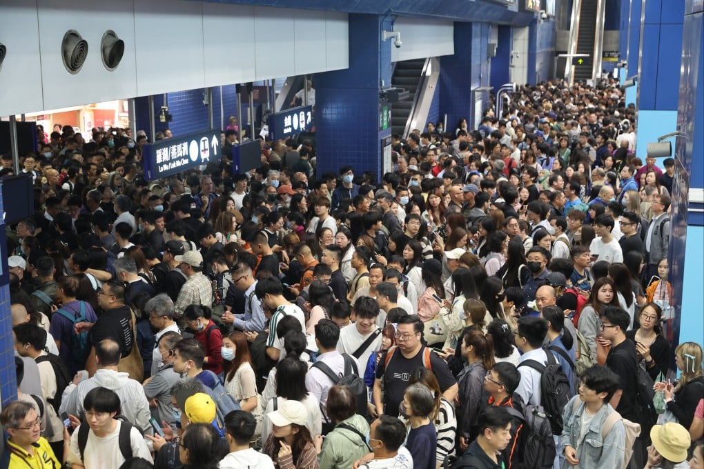 Stranded passengers wait at Tai Wai Station following a suspension of MTR services on the East Rail Line on March 27. A preliminary investigation found that a passenger opened the emergency exit ramp in the rear driver’s cabin of a northbound train that was travelling from Kowloon Tong to Tai Wai station. Photo: Edmond So