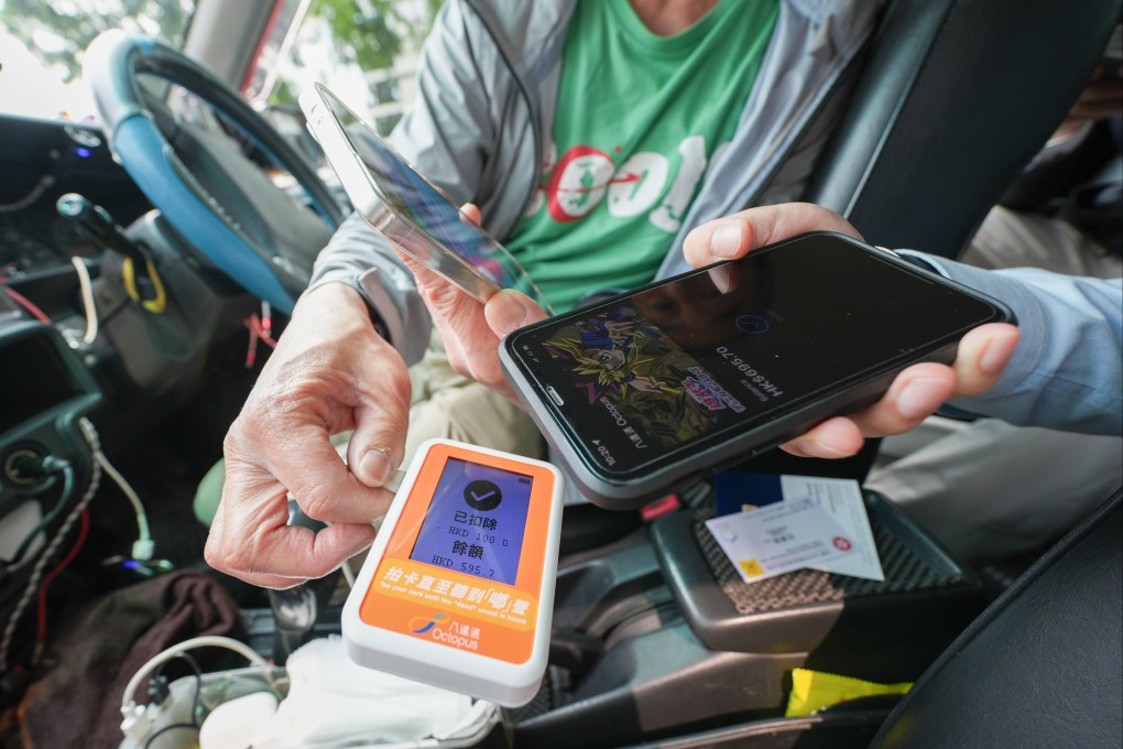 A taxi driver provides an e-payment method as the mandatory requirement takes effect on Wednesday. Photo: Eugene Lee