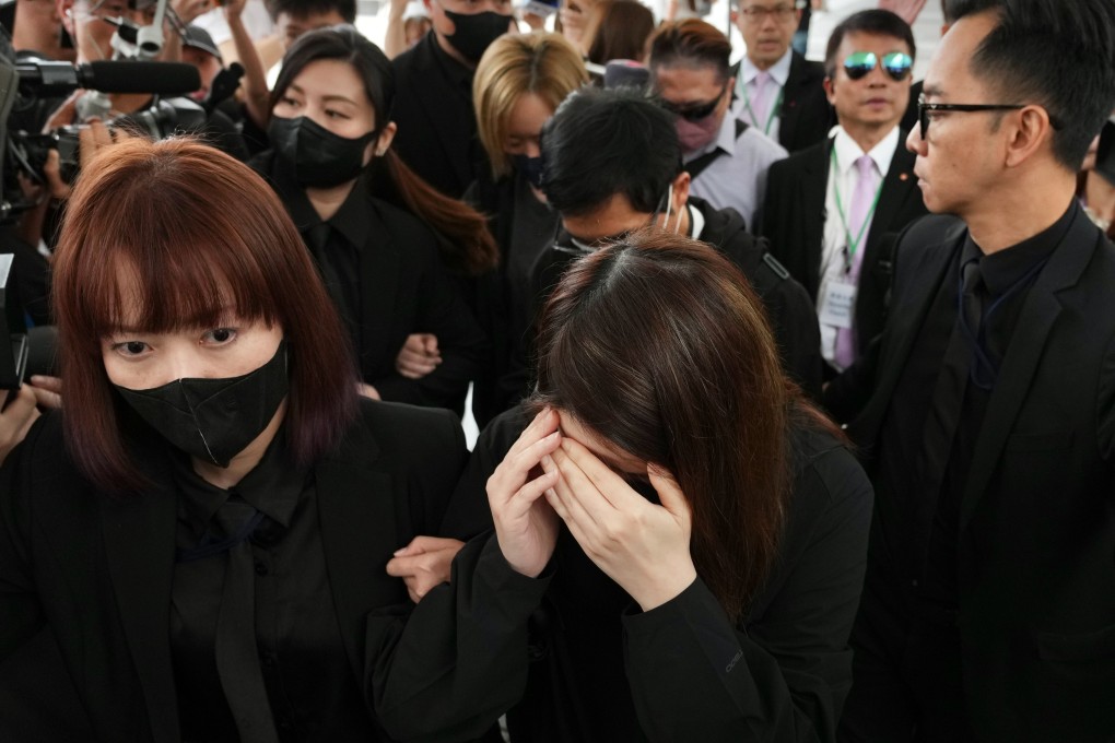 Witnesses from  property management company ISS EastPoint leave the hearing after Wednesday morning’s session. Photo: Karma Lo