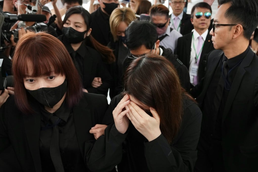 Witnesses from property management company ISS EastPoint leave the hearing after Wednesday morning’s session. Photo: Karma Lo