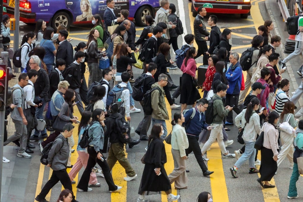 People cross a road in Central, Hong Kong’s premier business district, on March 9. Photo: Dickson Lee