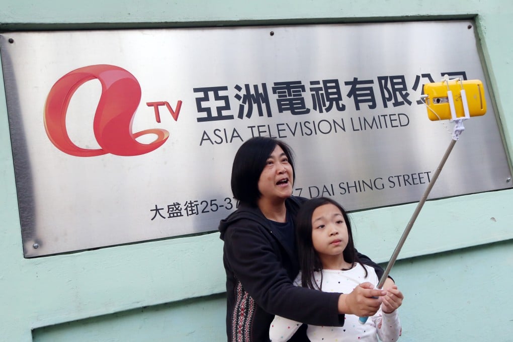 People taking a picture outside the ATV Headquarters in Tai Po on April 1, 2016. Photo: David Wong