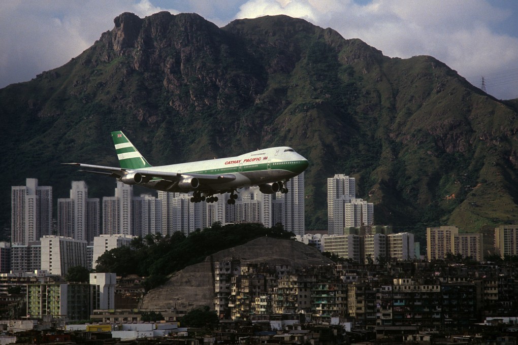 Cathay Pacific 747 with Lion Rock and Kowloon Walled City (1989), by Greg Girard. Photo: courtesy Greg Girard and WKM Gallery