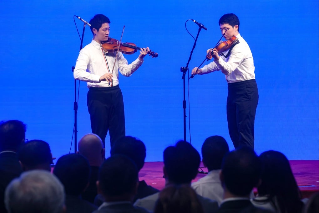 Brothers Jayden (left) and Hugo Pang perform at the event marking World Autism Awareness Day. Photo: Jonathan Wong
